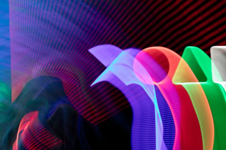 Colourful light trails on a dark background, AI-produced sportswear technology