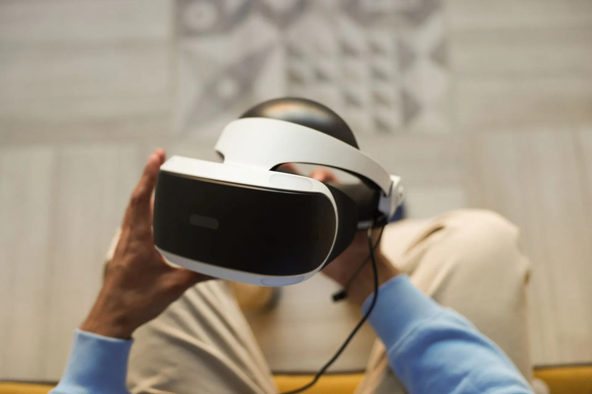 Person holding a VR headset, new technologies such as VR and 3D in sportswear