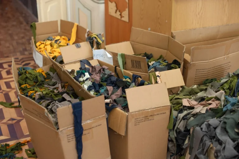 Cardboard boxes filled with sorted textile scraps ready for textile-to-textile recycling
