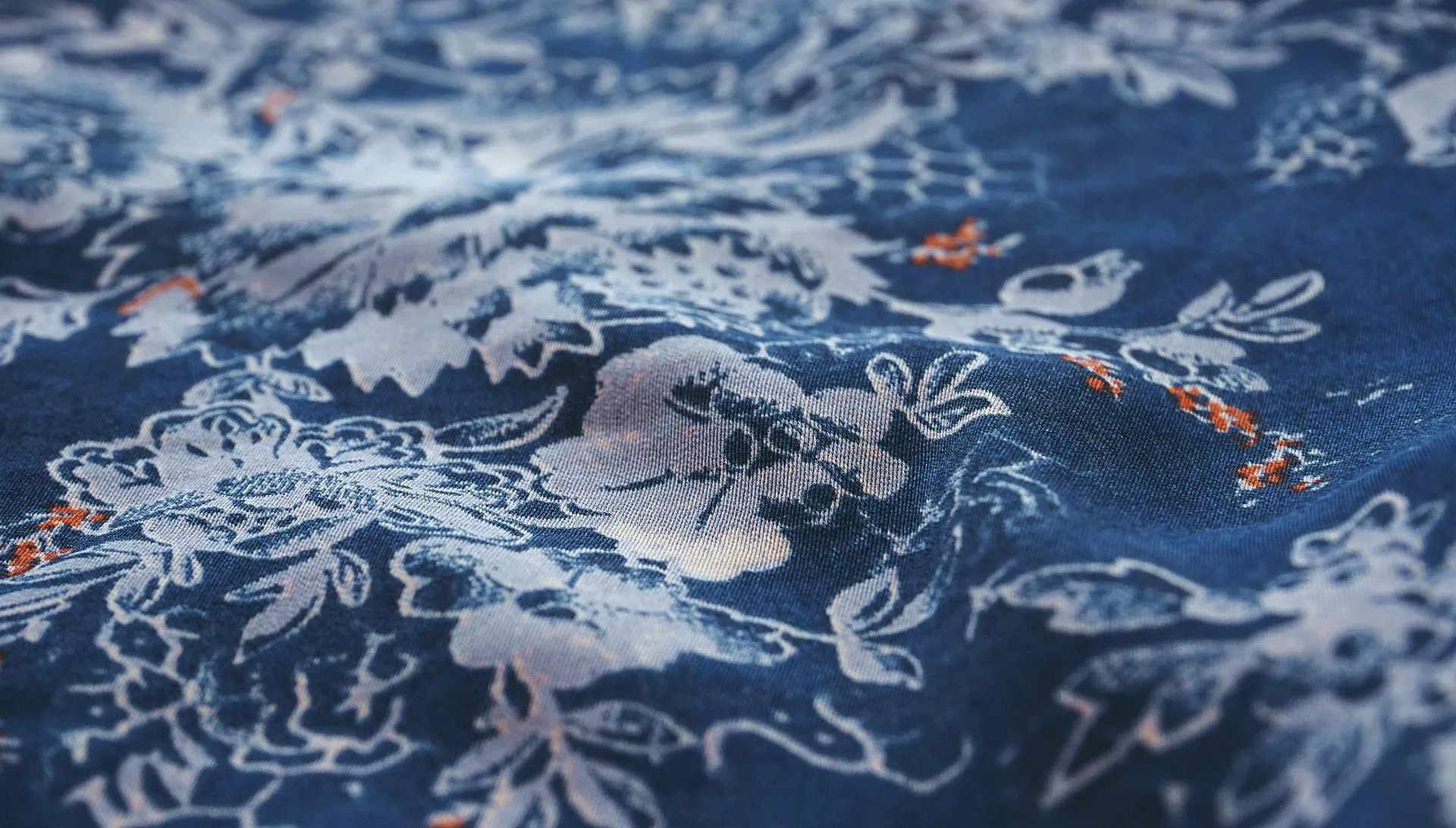 Close-up of a printed floral pattern on navy fabric, textile print innovation