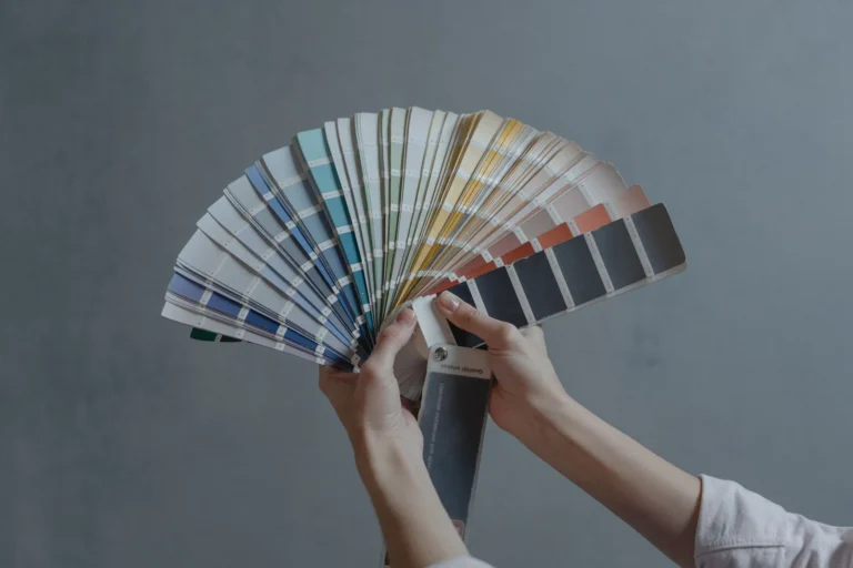 Hand fanning open a colour swatch book for sublimation colour matching