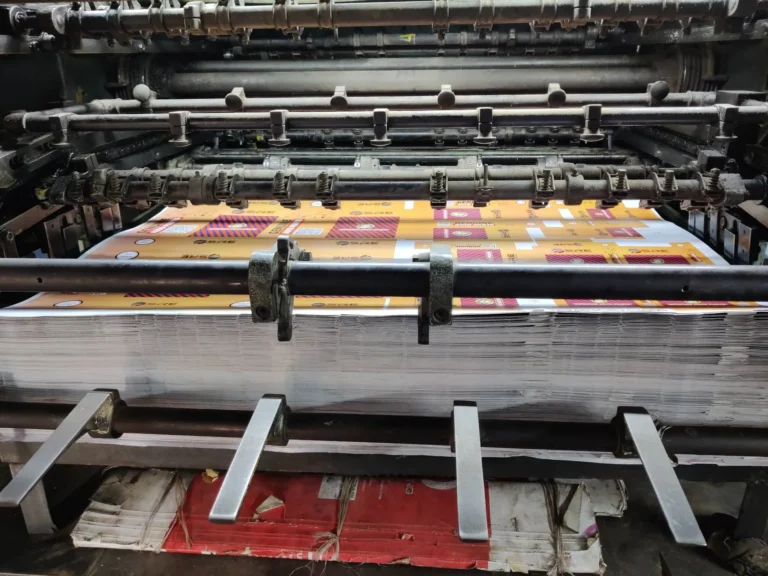 Industrial printing press with colourful printed sheets, hot topics in sublimation